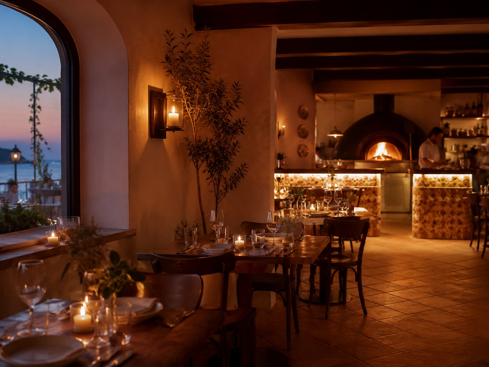 The warm, candlelit dining room at Cedar & Ember